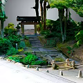 Traditional Japanese Garden With Wooden Pavilion Stone Steps Lush Greenery And Trees