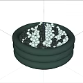 Sculpture Carving With Green Round Container Holding Black White Gray Balls