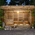 Courtyard Garden Featuring Thatch Roof Wooden Structure Bamboo Lattice Hanging Lantern Stone Path And Greenery