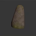 Carved Stone Sculpture With Spiral Patterns And Green Moss Covered Surface