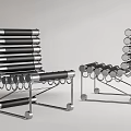 Modern Leisure Chair Featuring Black Stacked Layers And Metal Circular Rings Frame