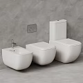 Sleek Modern White Toilets with Bidet Against Gray Wall in Bathroom Interior