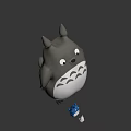 Gray Totoro Character With Pointed Ears White Belly And Small Blue Figure