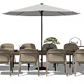 Outdoor Dining Table And Chairs Set With Umbrella And Green Plant