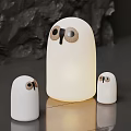 Three White Adorable Table Lamps With Eye Details Large Center And Small Sides Soft Light
