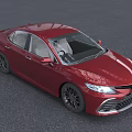 Red Toyota Sedan Modern Exterior Design With LED Headlights And Alloy Wheels