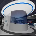 Modern Technology Exhibition Space With Circular Platform Blue Lighting And Digital Screens