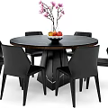 Round Marble Dining Table Set With Black Leather Chairs And Fruit Bowl