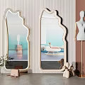 Elegant Modern Mirrors with Unique Shape in Room Featuring Striped Wall Mannequin and Figurines