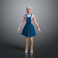 Woman with silver hair wearing blue pinafore dress and brown boots