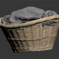 Wicker Storage Basket Containing Soft Gray Cloth For Daily Household Items