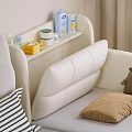 White Baby Crib With Headboard Side Shelf Holding Toiletries Striped Pillow Brown Teddy Bear