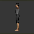 Man in Gray T shirt and Black Shorts with Arms Outstretched on Gray Background