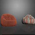 Two Different Bean Bag Chairs with Orange Velvety and Colorful Striped Designs