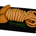 Sliced Cooked Squid Rings With Green Onions On Black Serving Plate
