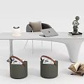 White Desk Setup With Laptop Lamp Green Sculpture Gray Chair Storage Baskets And Open Book