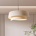 Modern Layered Pendant Light With White Shade And Soft Glow Near Green Plant