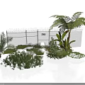 Modern Garden Area With Wire Fence Palm Tree Ferns And Lush Green Plants