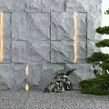 Courtyard Garden With Gray Stone Wall Illuminated Stripes Pine Tree Green Plants And Gravel Ground