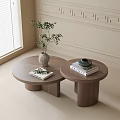 Round Wooden Tea Tables with Potted Plant Books and Decorative Moldings Near Window with Blinds