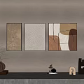 Three Panel Wall Art with Geometric Line Textured Designs on Gray Wall and Table Decor 3d model