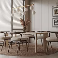 Elegant Modern Restaurant Dining Area With Round Table Wooden Chairs Pendant Lights And Framed