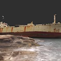 Old Rusted Abandoned Ship Moored Near Rocky Shore With Turquoise Water