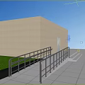 Outdoor Metal Railings Along Building Ramp with Green Grass and Gray Tiles