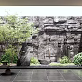 Courtyard Garden Design With Stone Wall Water Feature Green Plants Stone Tiles And Wooden Chairs