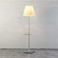 Modern Floor Lamp With Soft White Shade And Sleek Metal Frame Against White Wall