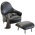 Modern Black Leather Lounge Chair With Ottoman And Cozy Throw Blanket