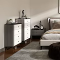 Modern Bedroom Interior Featuring Comfortable Bed Area Rug Accent Chair And Wall Art