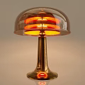 Modern Table Lamp with Transparent Shade Orange Light and Gold Base
