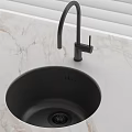 Round Black Kitchen Sink With High Arc Faucet On Marble Countertop