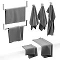 Soft Absorbent Cotton Towels Hanging On Metal Racks And Folded On Bathroom Countertop