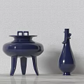 Two Blue Ceramic Vessels Tripod Cauldron And Slender Bottle On Light Tabletop With Wall Background 3d model