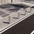 Silver Bollards With Yellow Tops Along Paved Sidewalk Near Tree Shadows