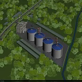 Modern Industrial Factory Surrounded by Lush Greenery With Large Storage Tanks And Cranes