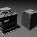 Two Black Square Industrial Equipment with Round Top Covers and Metal Base Structures