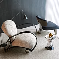 Elegant Modern Single Sofa With Patterned Fabric And Metal Floor Lamp On Circular Rug