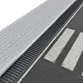 Road Facilities With Gray Paved Pavement Black Drainage Channel And White Crosswalk Lines