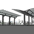 Bike Shelter With Curved Metal Roof And Multiple Support Posts For Parked Bicycles