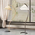 Modern Curved Floor Lamps With White Shades Near Window Blinds And Green Plant