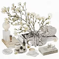 Elegant Tea Set Display with White Magnolia Flowers Glass Vase Books and Coffee Cup