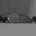 Modern Waterfront Hotel Building With Curved Exterior Illuminated By Lights And Surrounding Trees