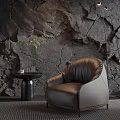 Leather Single Seater Sofa With Stone Texture Wall Black Table Green Plant And Floor Lamp