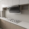 Modern Kitchen With Stainless Steel Range Hood And Gas Stove On Countertop