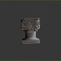 Plant Growing In Intricate Carved Stone Planter With Detailed Base Design