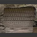 Stone Sculpture Carving Featuring Niche Structure With Intricate Carved Figures Rock Texture And Vines