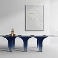 Modern Interior Featuring Glass Table With Blue Legs And Wall Art Decorative Items